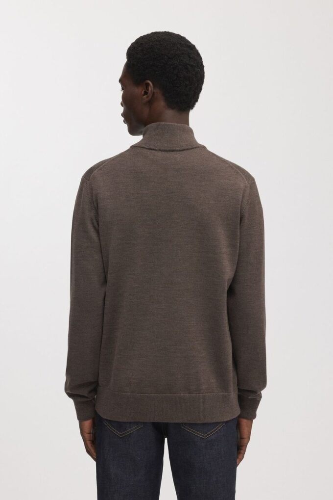 Der Merino-Pullover mit halbem Reißverschluss Der Merino-Pullover mit halbem Reißverschluss
