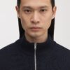Der Merino-Pullover mit halbem Reißverschluss Der Merino-Pullover mit halbem Reißverschluss