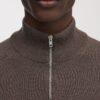 Der Merino-Pullover mit halbem Reißverschluss Der Merino-Pullover mit halbem Reißverschluss